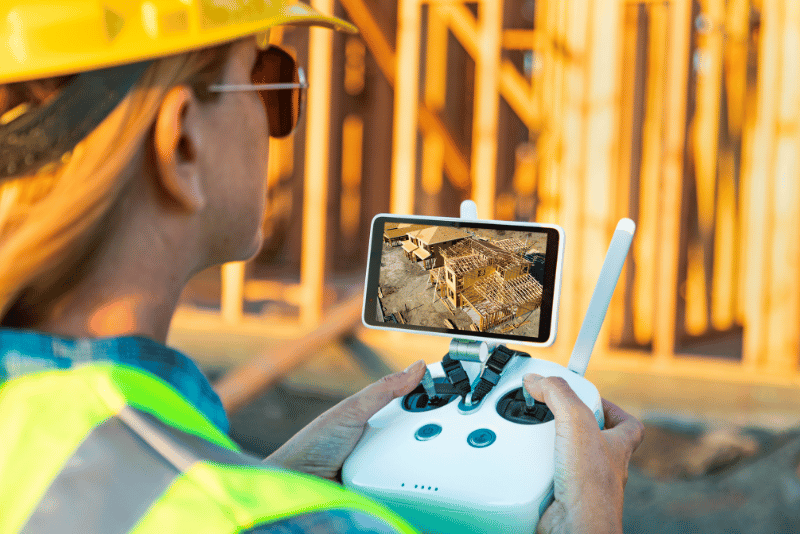 A drone capturing real-time data at a construction site, exemplifying drones' role in digital transformation.