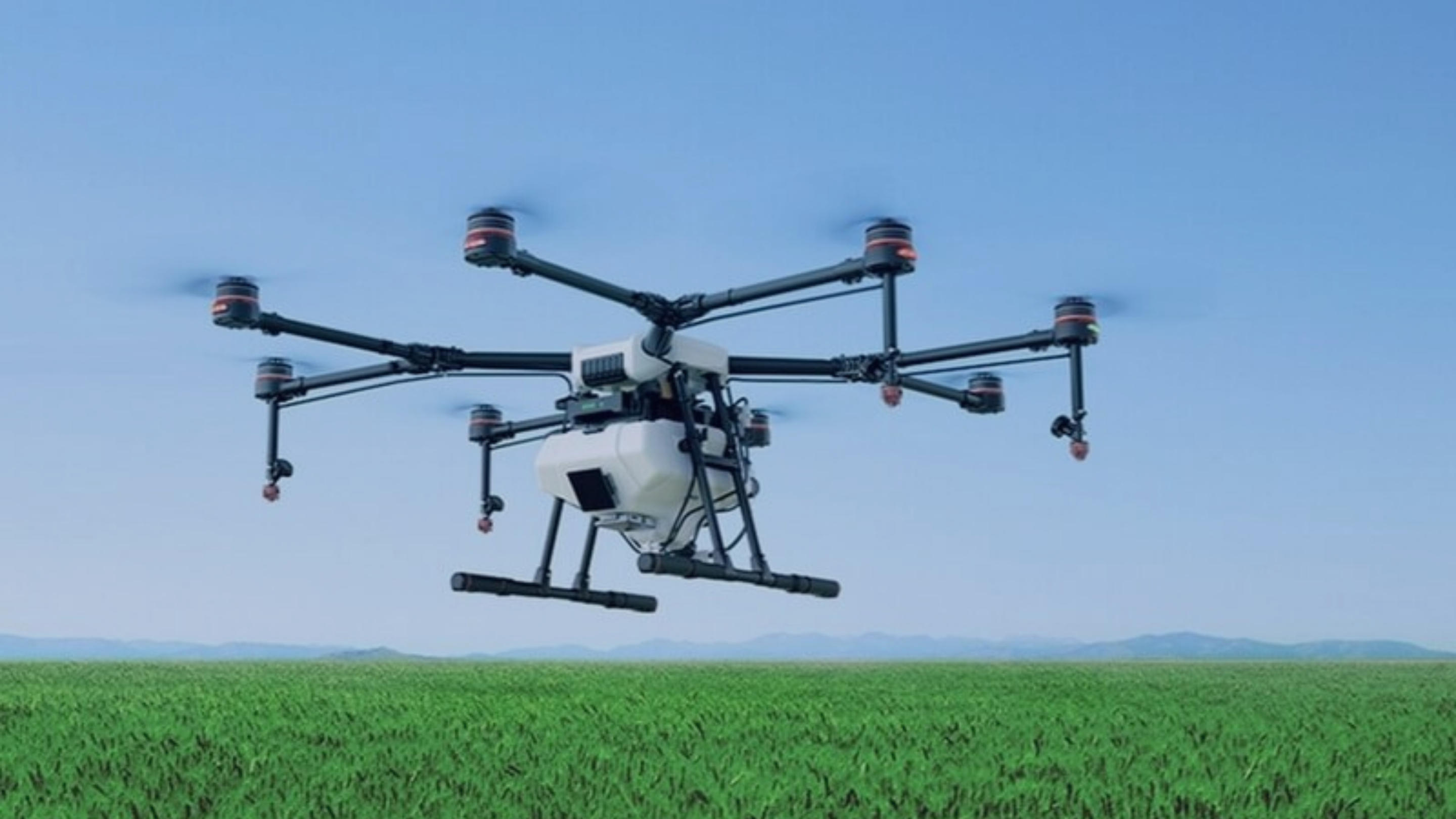a picture of DJI Agras Series flying on a field