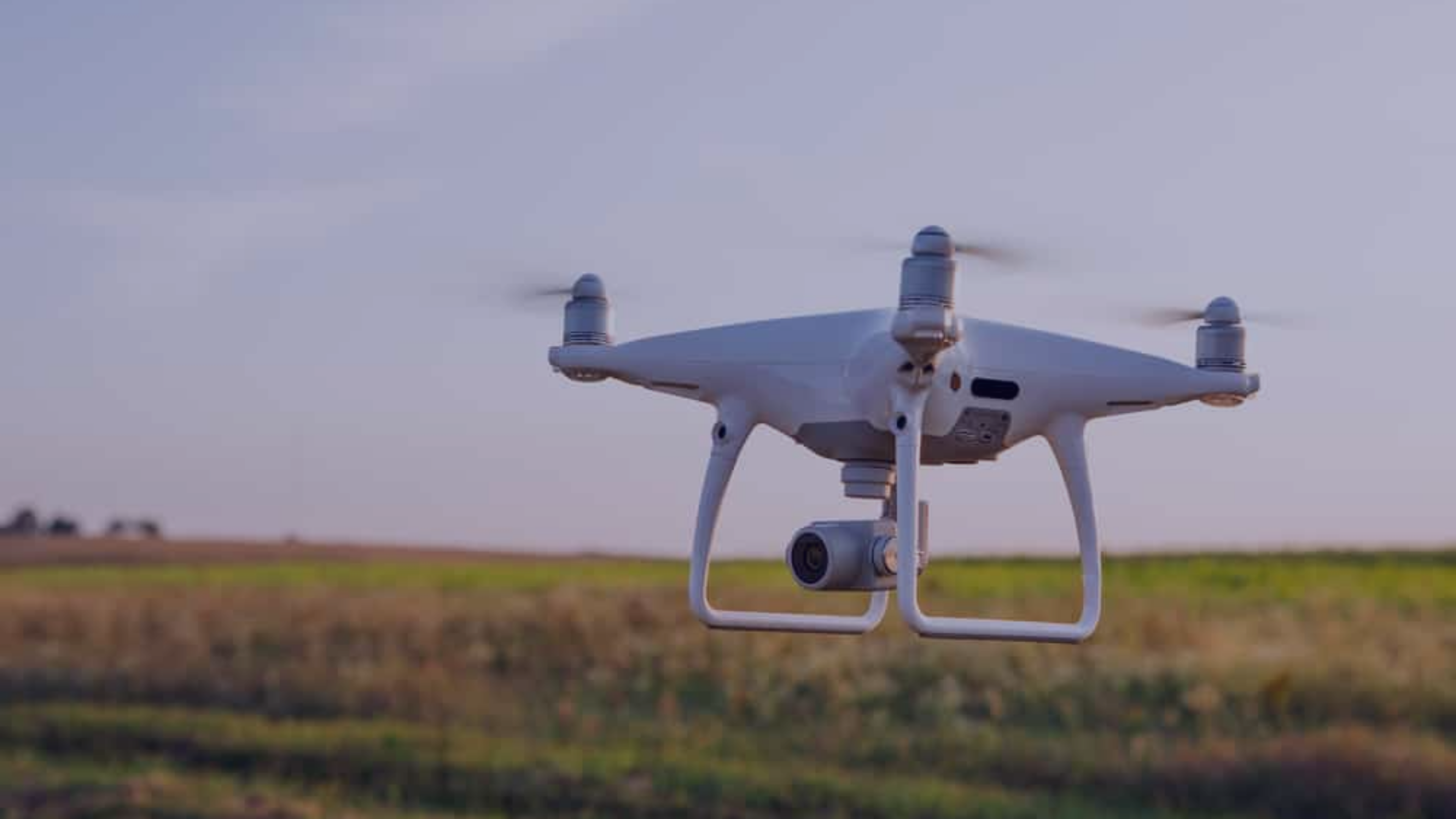 Flying drone on field