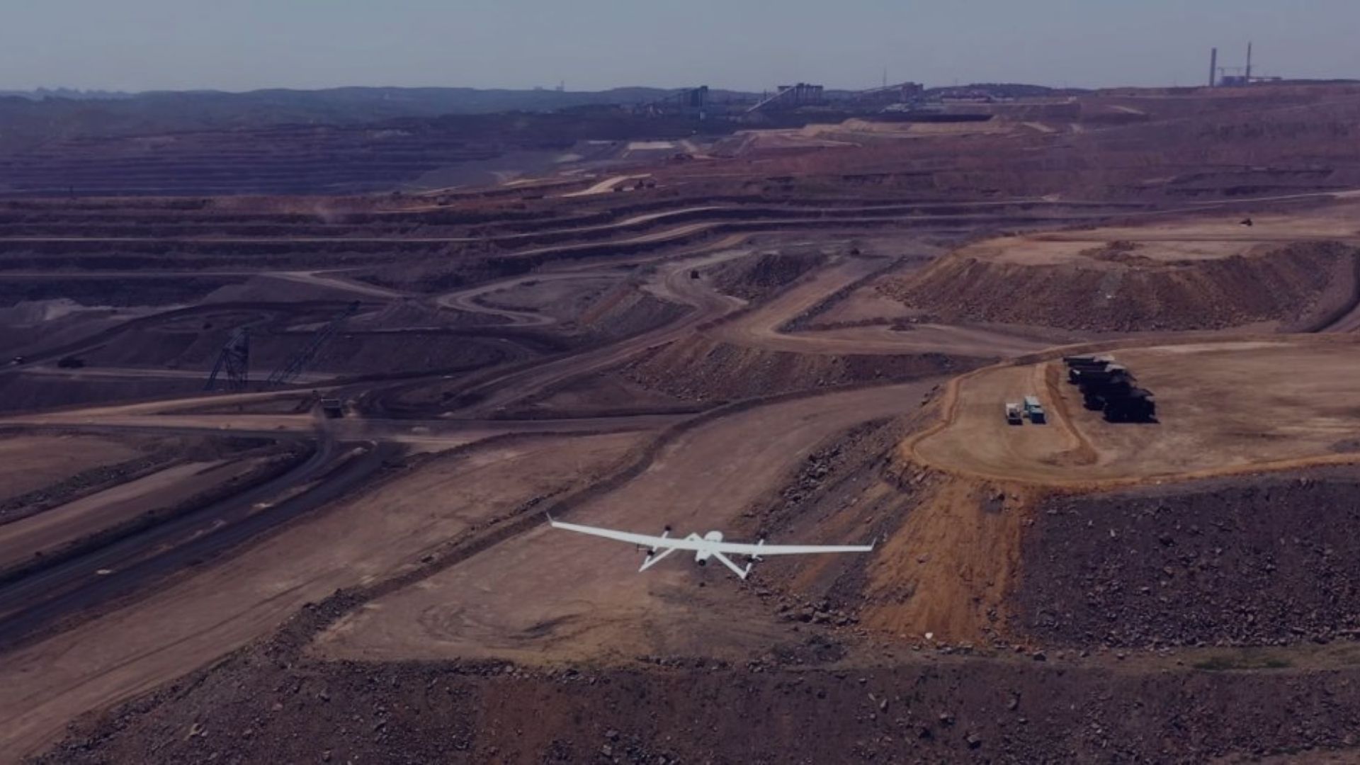 aircraft drone flyy in sky Surveying in a Mining Site
