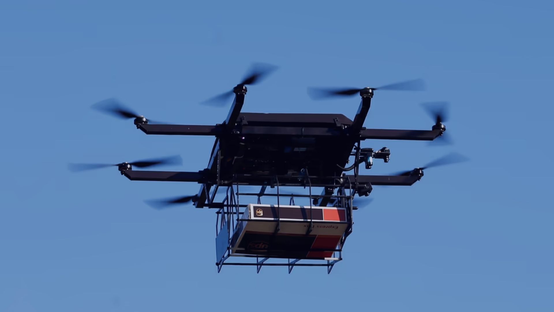 Multirotor Drones transporting package