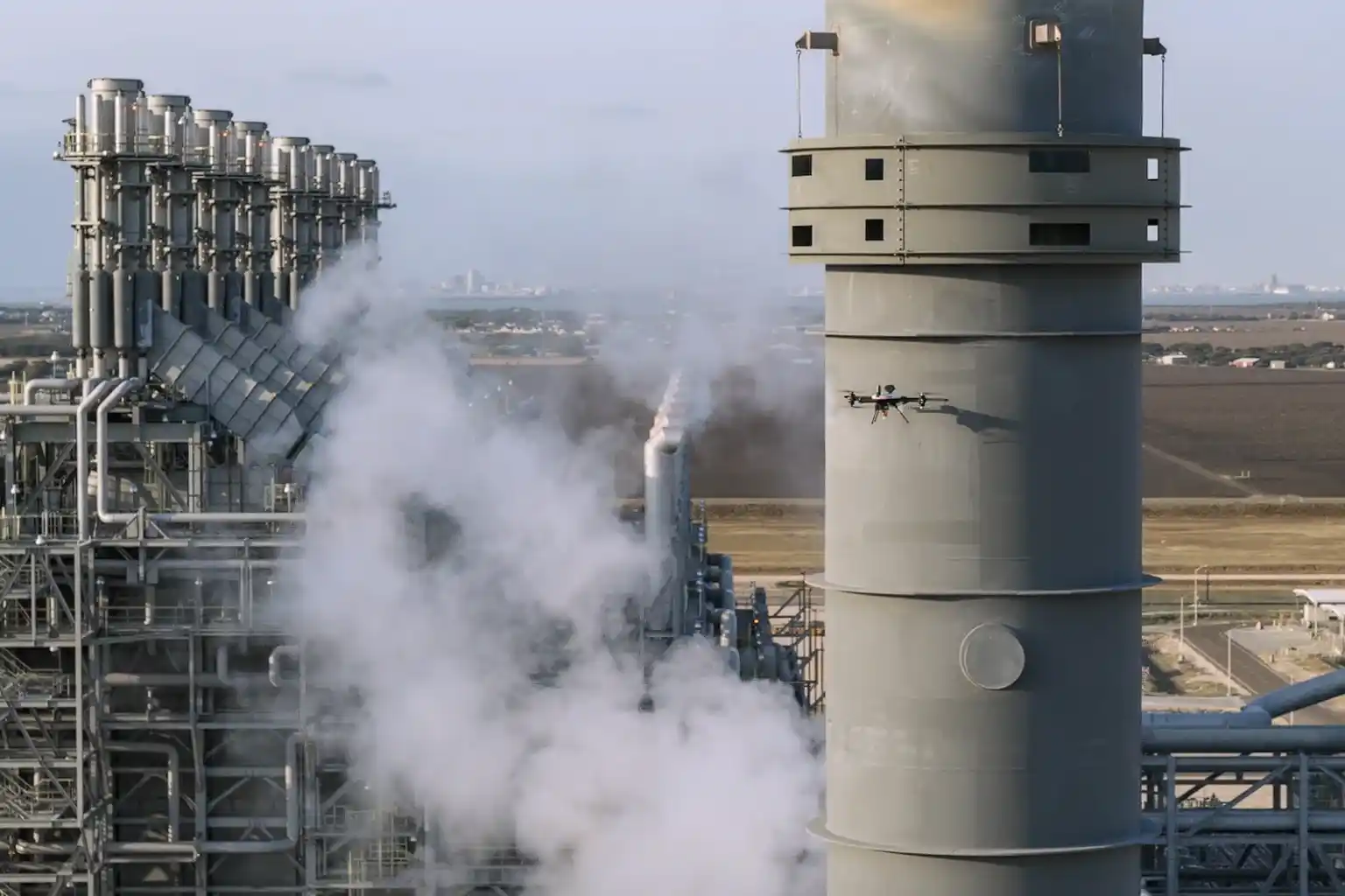 Inspection team reviewing drone data in control room.