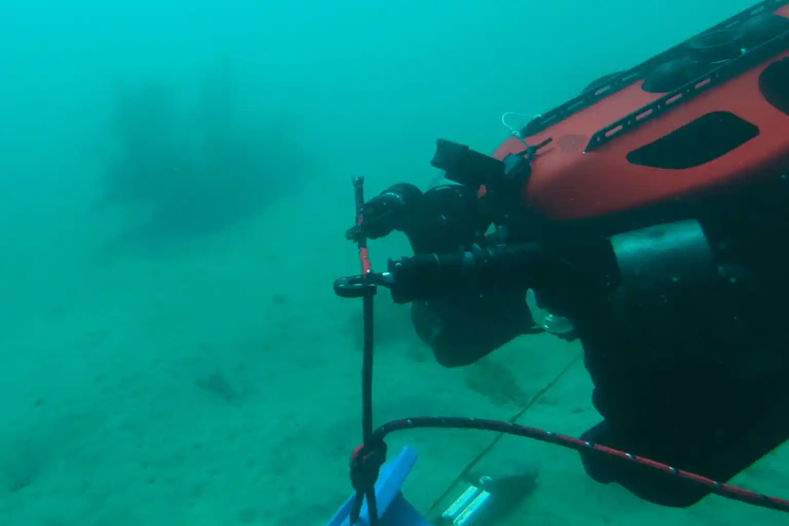 ROV taking sediment sample for offshore environmental compliance.