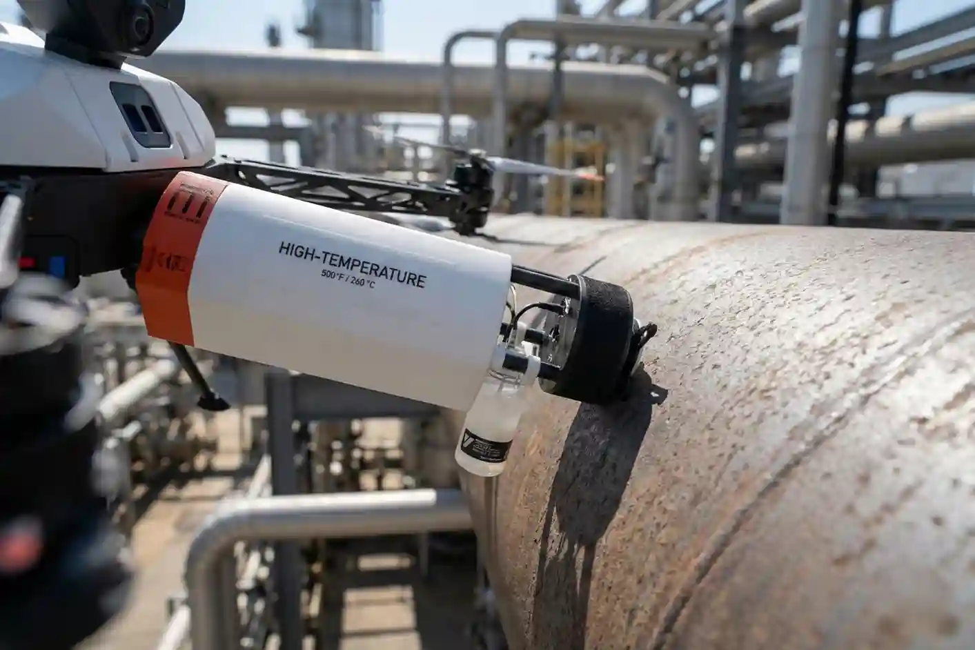 Close-up of Voliro T EMAT payload performing dry wall thickness measurement on a steel structure without liquid couplant.