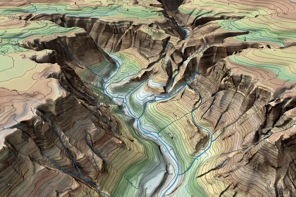 A high-fidelity 3D digital terrain model displayed on an engineering laptop, highlighting elevation contours and natural water drainage pathways across a desert plot.
