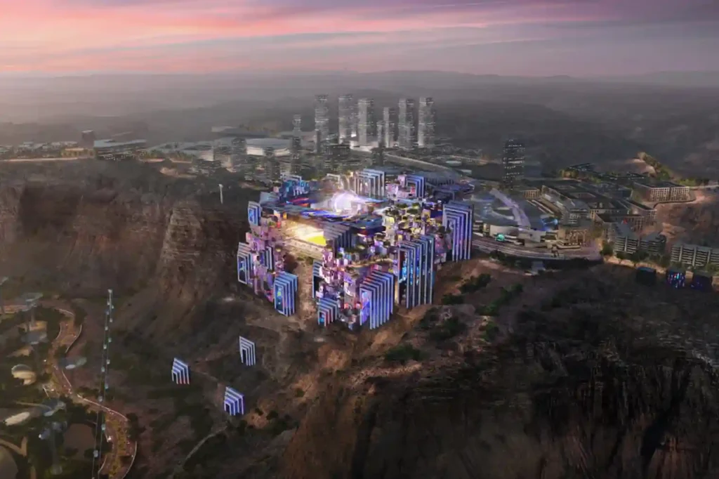 Panoramic wide-angle aerial shot of a modular sports stadium footprint positioned directly on top of a steep 200-meter mountain cliff edge.