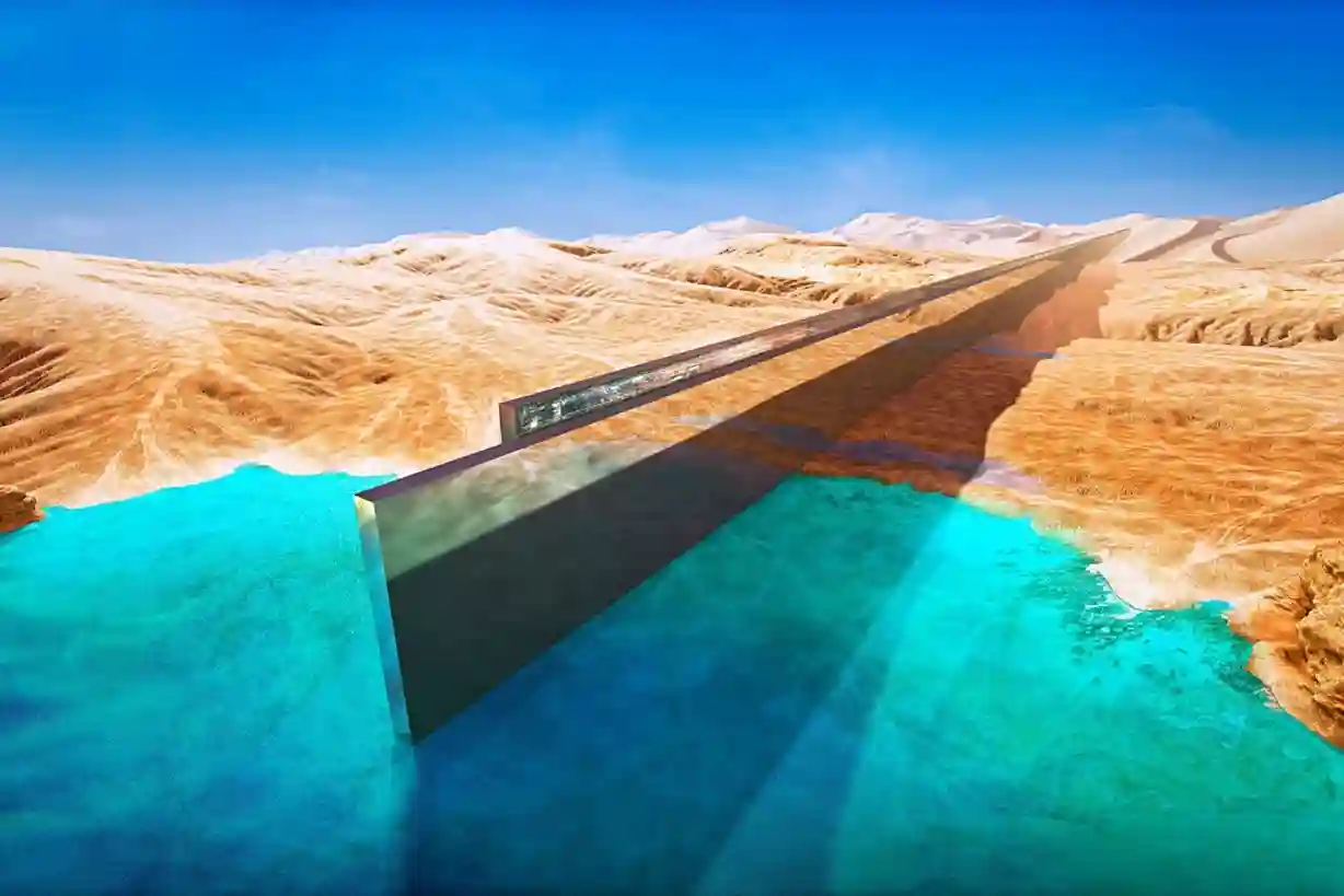 Wide aerial photograph of the long earthmoving trench excavated across desert terrain in northwestern Saudi Arabia.