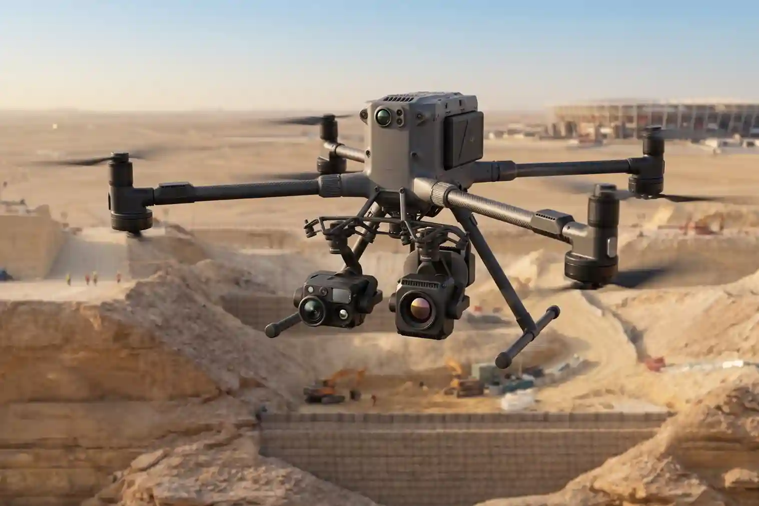 Heavy-lift DJI Matrice 400 enterprise quadcopter drone hovering steadily in mid-air with a dual-gimbal payload system mounted underneath its frame.