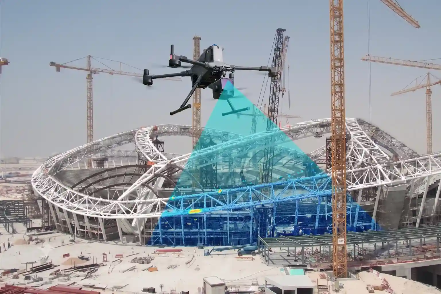 A large grey DJI Matrice enterprise quadcopter drone hovering steadily in mid-air, carrying a professional Zenmuse L3 laser scanner payload underneath its frame.