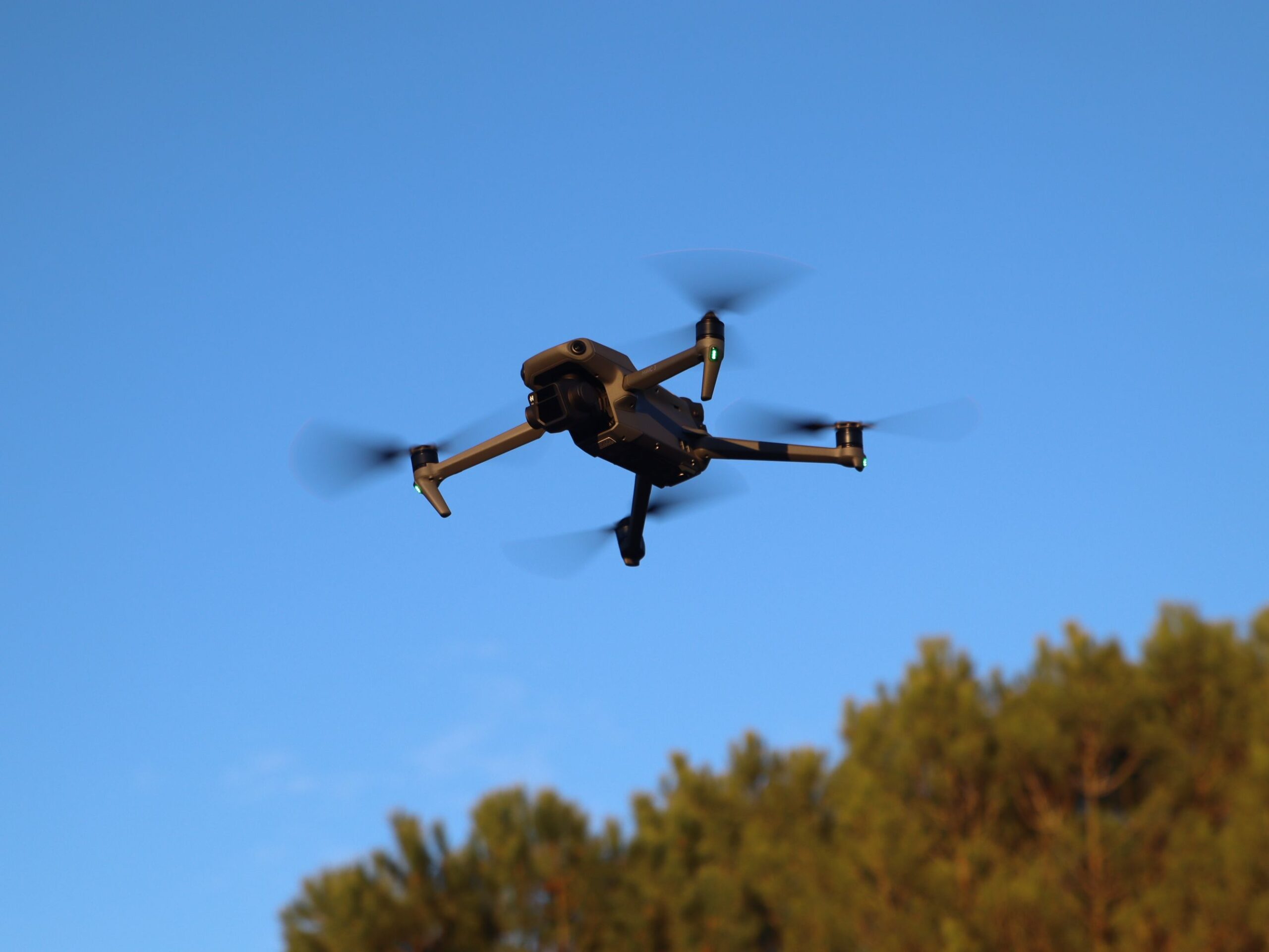 A DJI Mavic 3 RTK survey drone flying in mid-air to capture aerial photogrammetry for an urban master planning project.