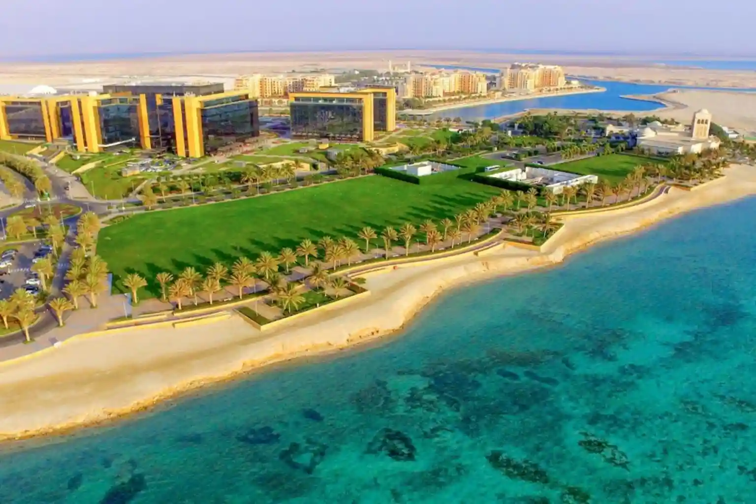 Wide aerial view of King Abdullah Economic City Special Economic Zone infrastructure and logistics port in Saudi Arabia.