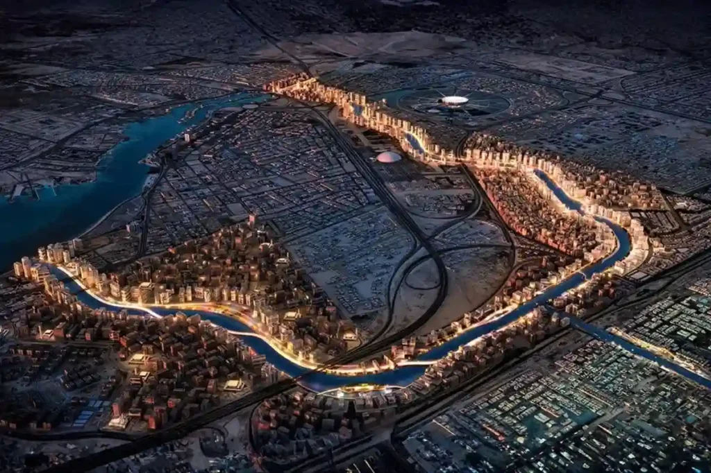 High-altitude aerial top-down view of an industrial park drainage canal and stormwater retention basin in Jeddah Industrial City.