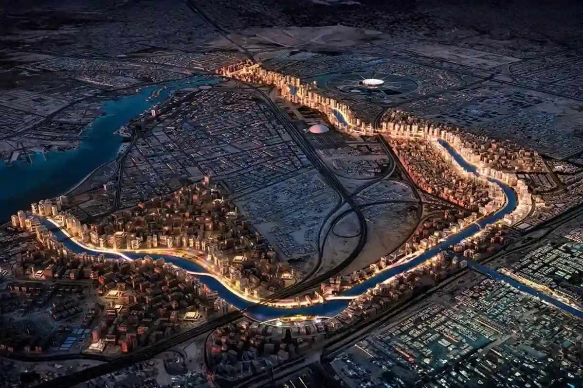 High-altitude aerial top-down view of an industrial park drainage canal and stormwater retention basin in Jeddah Industrial City.