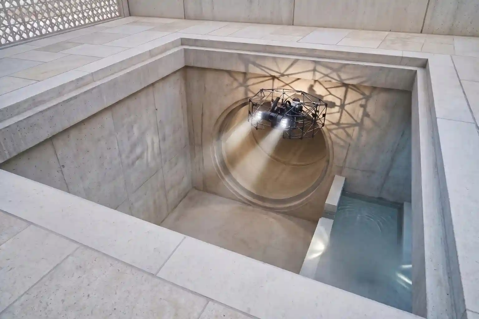 Terra Xross 1 caged drone hovering inside a large dry concrete trunk sewer.