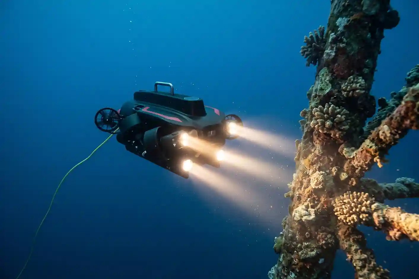 QYSEA FIFISH PRO W6 NAVI subsea ROV operating underwater near a submerged quay wall and vessel hull.